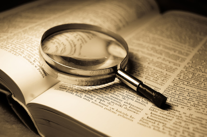Book and glass loupe
