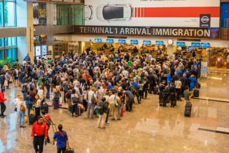People waiting in queue at arrival immigration of Changi airport